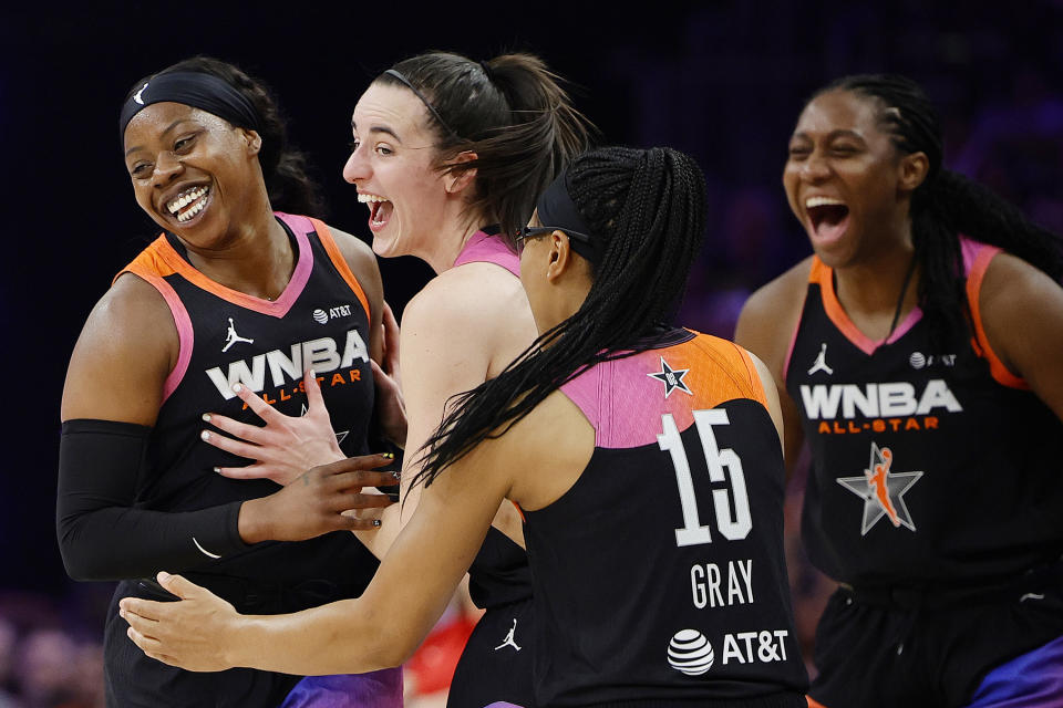 PHOENIX, ARIZONA - JULY 20: Arike Ogunbowale #24 celebrates a three-pointer with Caitlin Clark #22 and Allisha Gray #15 of Team WNBA in the second half against Team USA during the 2024 WNBA All Star Game at Footprint Center on July 20, 2024 in Phoenix, Arizona. Team WNBA defeated Team USA 117-109. (Photo by Alex Slitz/Getty Images)