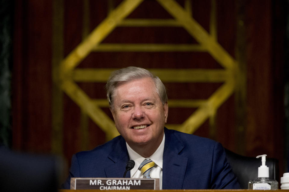 Chairman Sen. Lindsey Graham, R-S.C., smiles during a Senate Judiciary Committee hearing on Capitol Hill in Washington, Tuesday, June 9, 2020, to examine COVID-19 fraud, focusing on law enforcement's response to those exploiting the pandemic. (AP Photo/Andrew Harnik, Pool)