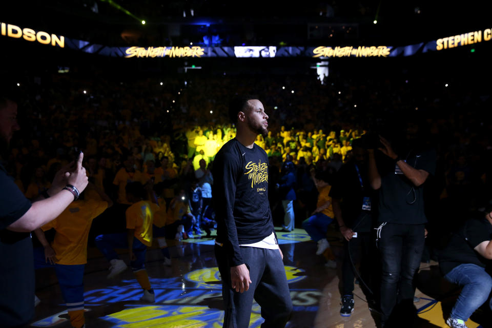 OAKLAND, CALIFORNIA - APRIL 13:   Stephen Curry #30 of the Golden State Warriors stands on the court during player introductions before their game against the LA Clippers during Game One of the first round of the 2019 NBA Western Conference Playoffs at ORACLE Arena on April 13, 2019 in Oakland, California. NOTE TO USER: User expressly acknowledges and agrees that, by downloading and or using this photograph, User is consenting to the terms and conditions of the Getty Images License Agreement. (Photo by Ezra Shaw/Getty Images)