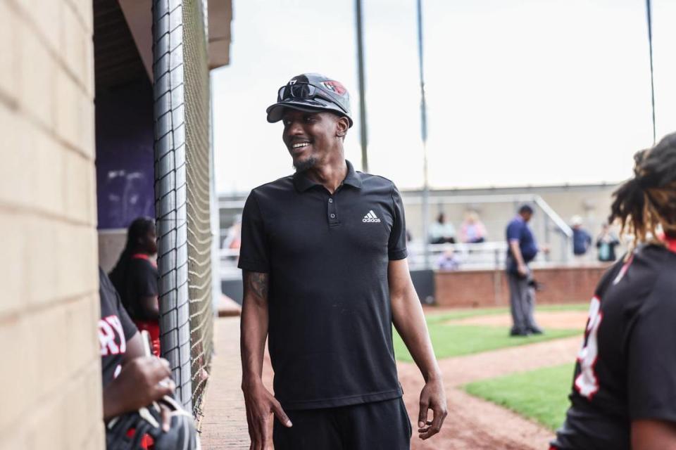 Berry’s coach Malcolm Elliott smiles at players at Ardrey Kell High School in Charlotte, N.C., on Tuesday, March 28, 2023.