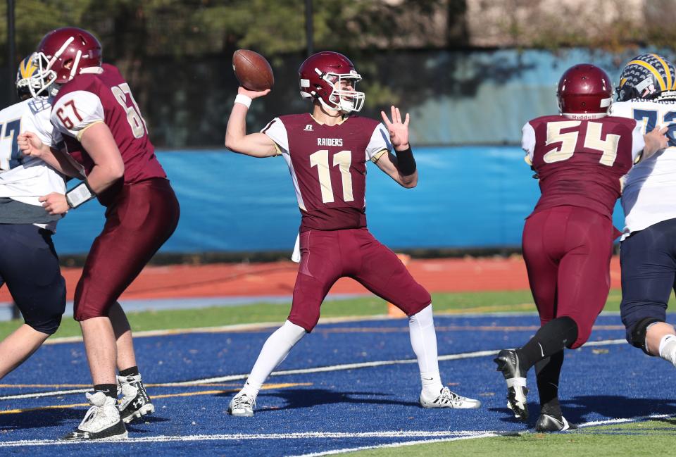 O'Neill's Nick Waugh (11) looks for an open receiver against Warrensburg during the Class C state semifinal at Middletown High School Nov. 26, 2022.