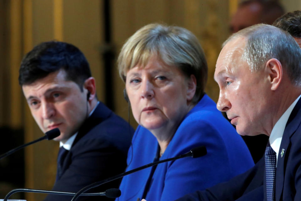 Ukraine's President Volodymyr Zelenskiy, German Chancellor Angela Merkel and Russia's President Vladimir Putin attend a joint news conference after a Normandy-format summit in Paris, France December 10, 2019. REUTERS/Charles Platiau/Pool?     TPX IMAGES OF THE DAY