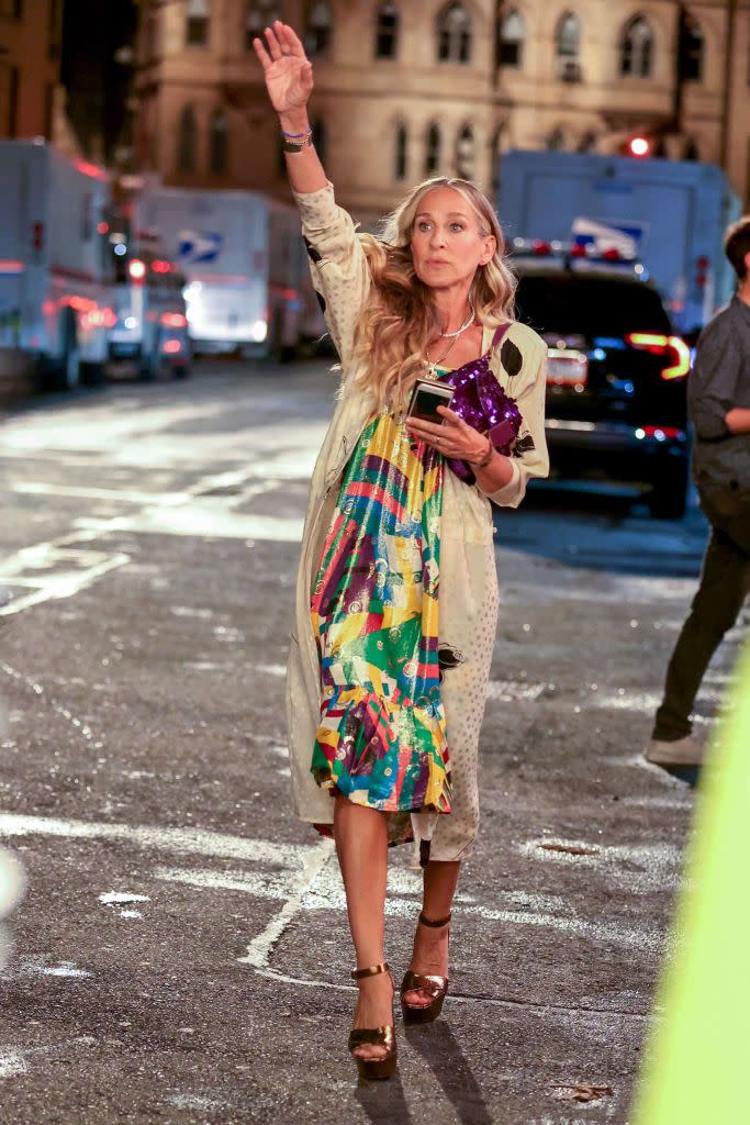 <p>It's quite jarring seeing the SATC ladies with smart phones isn't it? Anyway... Parker's accessories game is on top form for the night out scene as she carries a vintage purple sequin Fendi baguette bag and stomps the streets of Manhattan in her YSL Farrah sandals.</p><p><a class="link " href="https://us.vestiairecollective.com/women-shoes/sandals/saint-laurent/farrah/" rel="nofollow noopener" target="_blank" data-ylk="slk:SHOP YSL FARRAH HEELS ON VESTIAIRE;elm:context_link;itc:0;sec:content-canvas"> SHOP YSL FARRAH HEELS ON VESTIAIRE</a></p>