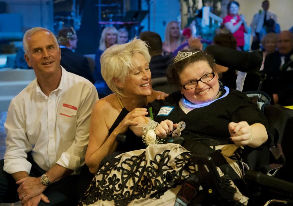 Judy Peterson, center, celebrates with Sheila Keithley, right, during the “Night to Shine” event recently at Sanibel Community Church on Sanibel Island. The annual event celebrates people with special needs and is presented by the Tim Tebow Foundation. More than 600 churches across the country participated.