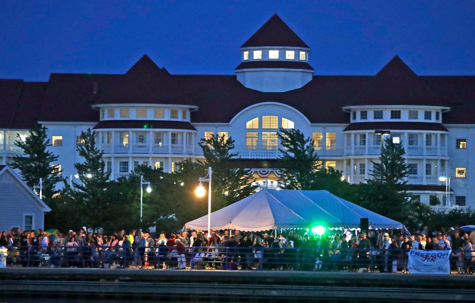 Blue Harbor Resort and Spa towers over the crowd at Freedom Fest on south pier. Friday, July 2, 2021, in Sheboygan, Wis.