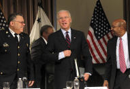 U.S. Vice President Joe Biden (C) makes a remark on the resignation of Pope Benedict XVI next to Philadelphia Mayor Michael Nutter (R) and Police Commissioner Charles Ramsay (L) at the conclusion of a roundtable discussion on gun control at Girard College in Philadelphia, Pennsylvania, February 11, 2013. Biden was joined by members of law enforcement and politicians to discuss gun law reforms. REUTERS/Tim Shaffer (UNITED STATES - Tags: POLITICS CRIME LAW) - RTR3DNI7