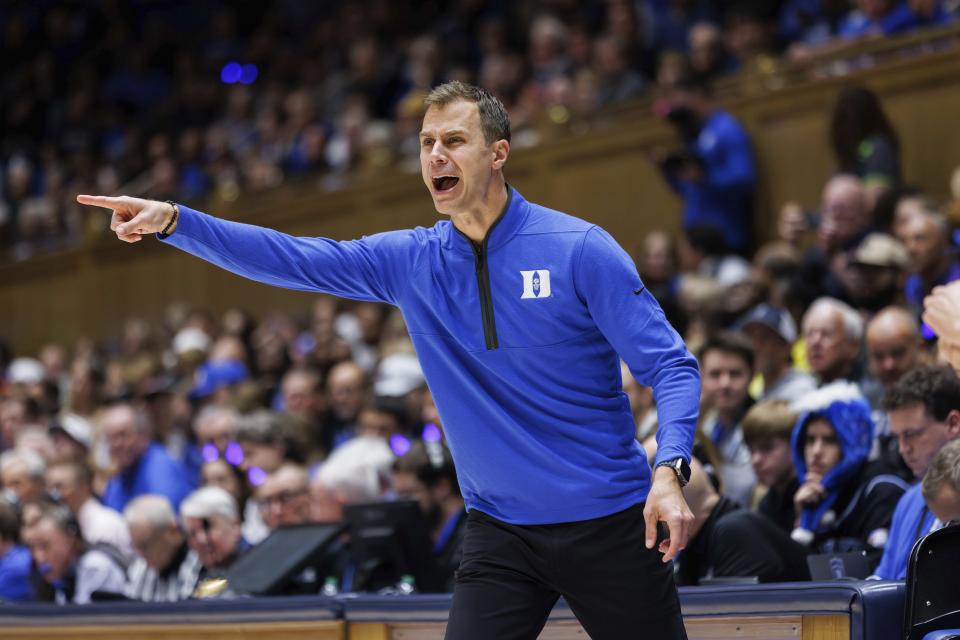 Duke head coach Jon Scheyer shouts towards the court during the first half of an NCAA college basketball game against Bucknell in Durham, N.C., Friday, Nov. 17, 2023. (AP Photo/Ben McKeown)