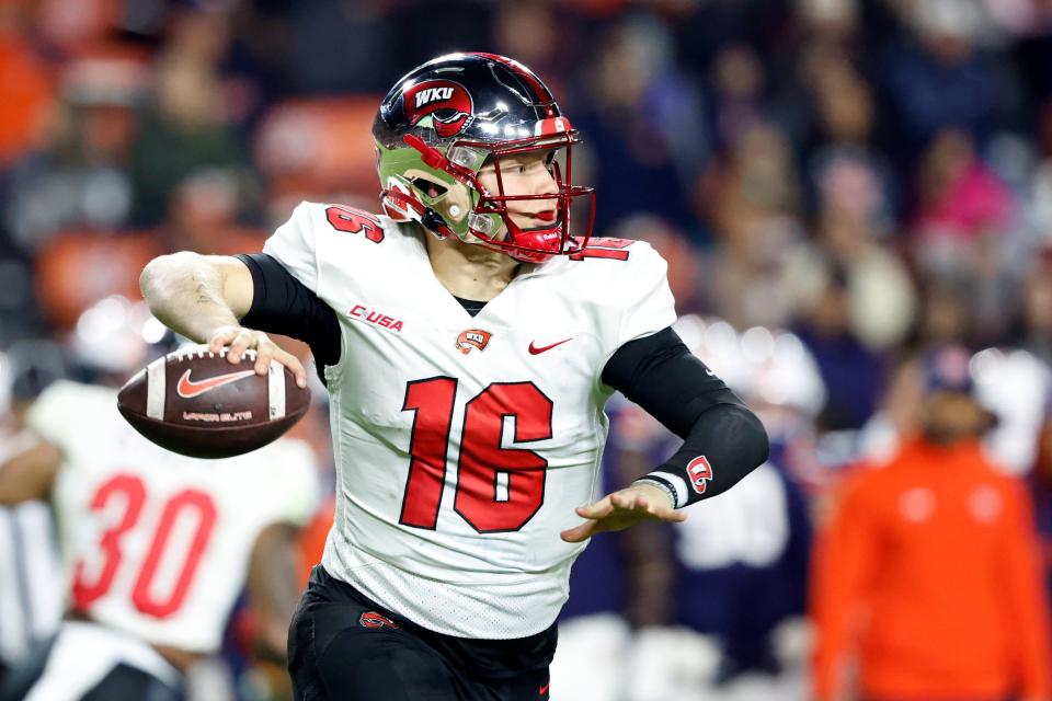 Western Kentucky quarterback Austin Reed throws a pass during the second half of an NCAA college football game against Auburn, Saturday, Nov. 19, 2022, in Auburn, Ala. (AP Photo/Butch Dill)