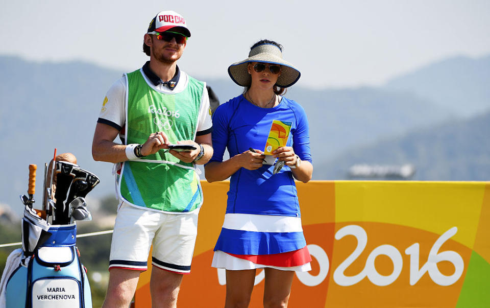 Maria Verchenova of Russia sports a vacation-inspired look as she prepares to play from the fourth tee during the First Round of Women's Golf. (Photo: Getty)