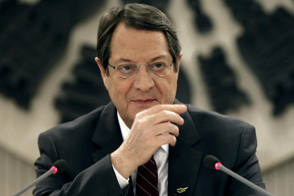 Cyprus President Nicos Anastasiades speaks during a nationally televised news conference at the Presidential Palace in Nicosia, Cyprus, Wednesday, Feb. 12, 2014. Anastasiades held the conference to defend a document he agreed with Turkish Cypriot leader Dervis Eroglu that paved the way for the resumption of negotiations a day earlier aimed at reunifying the war-divided island. Anastasiades faces strong pressure from critics who argue that the document contains the seeds of possible Turkish Cypriot statehood, which could unravel any peace accord. (AP Photo/Petros Karadjias)