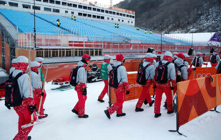 FILE PHOTO - Alpine Skiing – Pyeongchang 2018 Winter Olympics – Men’s Downhill – Yongpyong Alpine Centre - Pyeongchang, South Korea – February 10, 2018 - Volunteers leave the Yongpyong Alpine venue. Picture taken February 10, 2018. REUTERS/Mike Segar