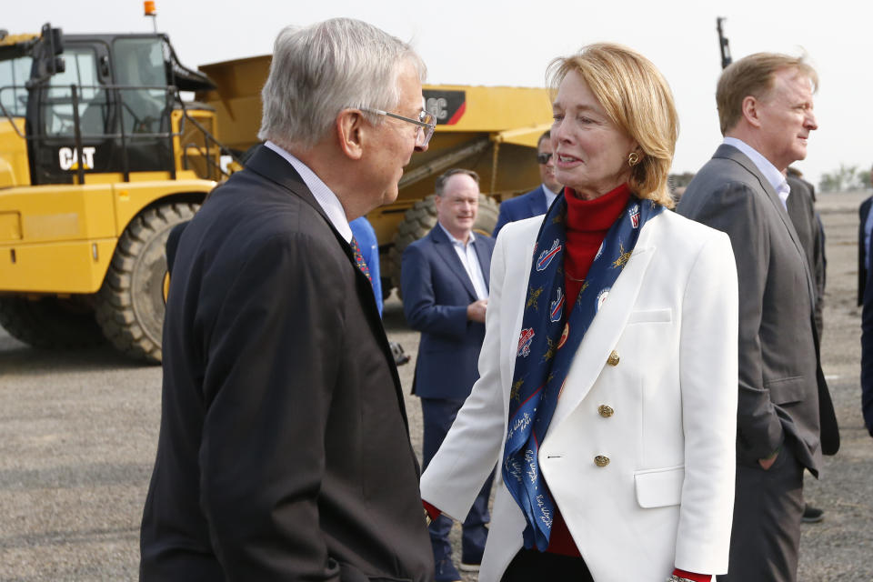 Buffalo Bills owner Terry Pegula, left, talks with Mary Wilson, wife of the late Bills owner Ralph Wilson, prior to the groundbreaking ceremony at the site of the new Bills Stadium in Orchard Park, N.Y., Monday June 5, 2023. At right is NFL commissioner Roger Goodell. (AP Photo/Jeffrey T. Barnes)