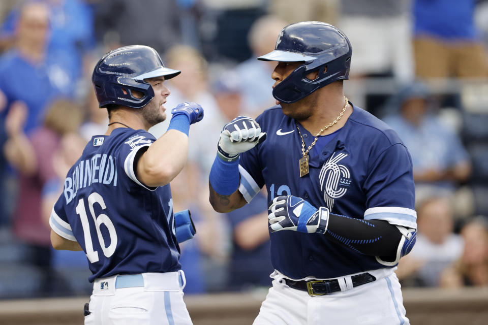 Kansas City Royals' Salvador Perez, right, celebrates with Andrew Benintendi at home plate after hitting a two-run home run against the Baltimore Orioles during the first inning of a baseball game in Kansas City, Mo., Friday, June 10, 2022. (AP Photo/Colin E. Braley)