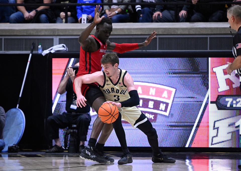 Jan 2, 2023; West Lafayette, Indiana, USA;  Purdue Boilermakers guard Braden Smith (3) pushes against Rutgers Scarlet Knights forward Mawot Mag (3) during the first half at Mackey Arena.