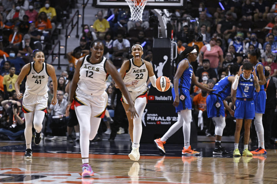 The Las Vegas Aces celebrate their win in the WNBA basketball finals against the Connecticut Sun, Sunday, Sept. 18, 2022, in Uncasville, Conn. (AP Photo/Jessica Hill)