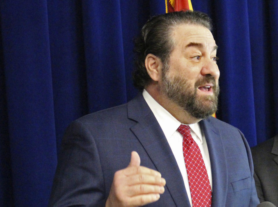 Arizona Attorney General Mark Brnovich addresses a news conference in Phoenix.