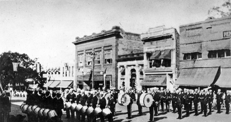 In 1924, Tallahassee celebrated its 100th anniversary with a weeklong Florida Centennial, which included parades, pageants, contests and speeches. Here, looking east, the U.S. Navy band performs on Monroe Street, between College Avenue and Park Avenue.