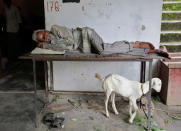 <p>A man takes a rest at a temporary shelter after several areas were flooded in Allahabad, India, Monday, Aug. 22, 2016. Heavy rainfall in the upper reaches of the country has caused rivers to overflow endangering lives and properties of people along the river Ganges as also in other parts of the country. (AP Photo/Rajesh Kumar Singh) </p>