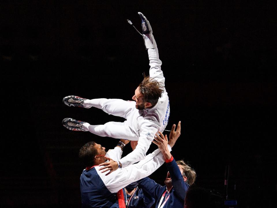 French fencer tossed in air by coaches at the Olympics.