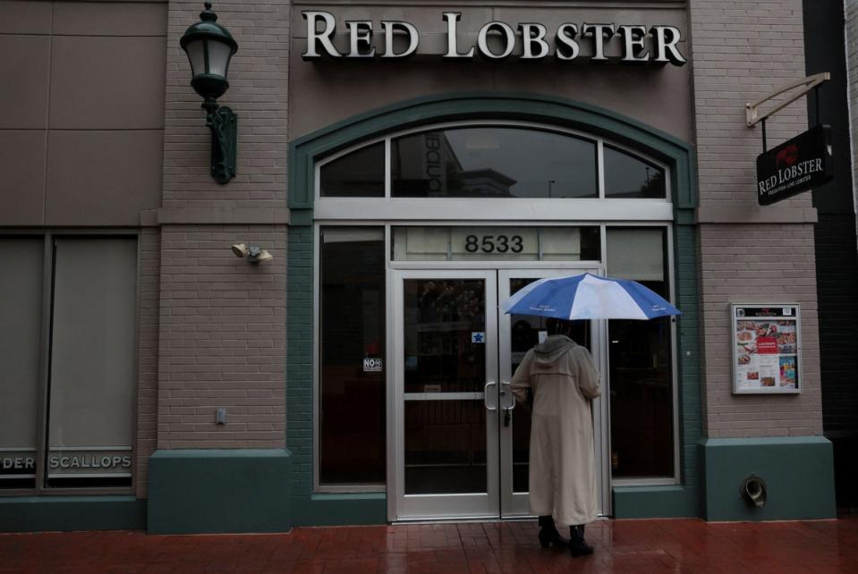 A sign taped to a door announcing the closure of a Red Lobster in Silver Spring, Maryland (REUTERS)