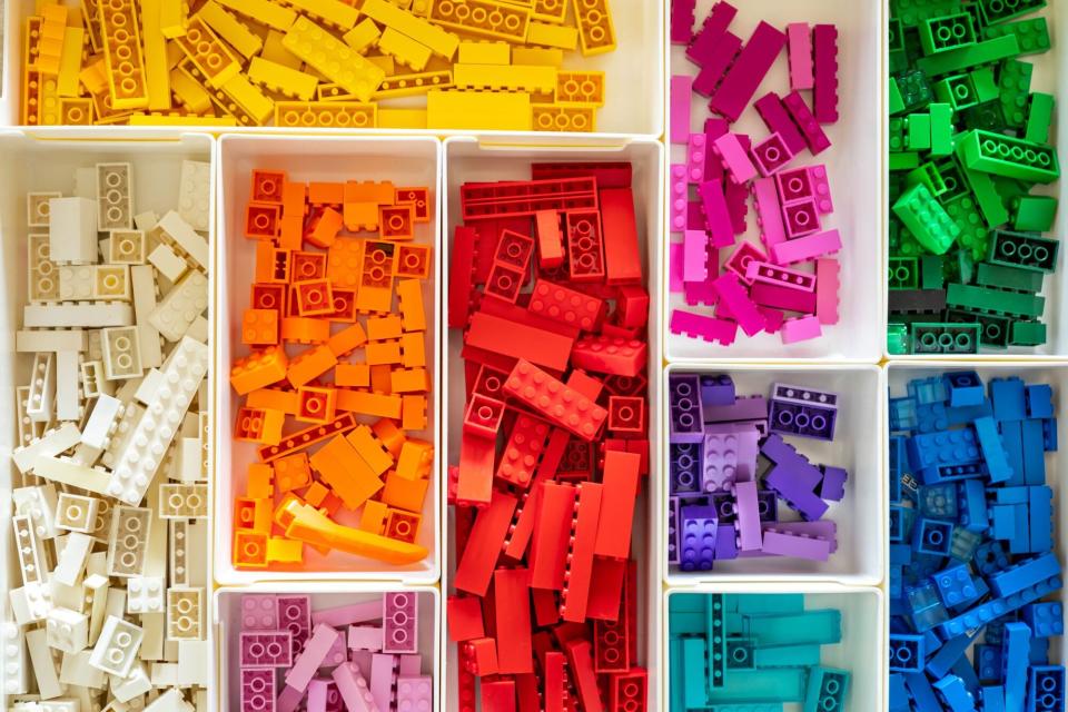 Color-organized legos in a organization bin