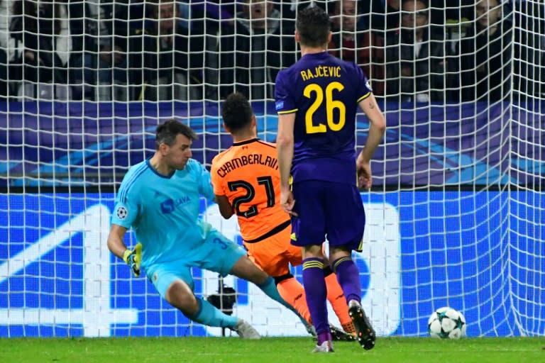 Liverpool's Alex Oxlade-Chamberlain scores past Maribor's Jasmin Handanovic (rear L) during their at the Ljudski vrt Stadium, in Maribor, on October 17, 2017