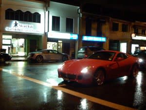 Expensive cars on a Singapore road