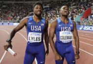 United States men's 4x100 relay gold winners Noah Lyles and Christian Coleman, right, celebrate at the World Athletics Championships in Doha, Qatar, Saturday, Oct. 5, 2019. (AP Photo/Hassan Ammar)