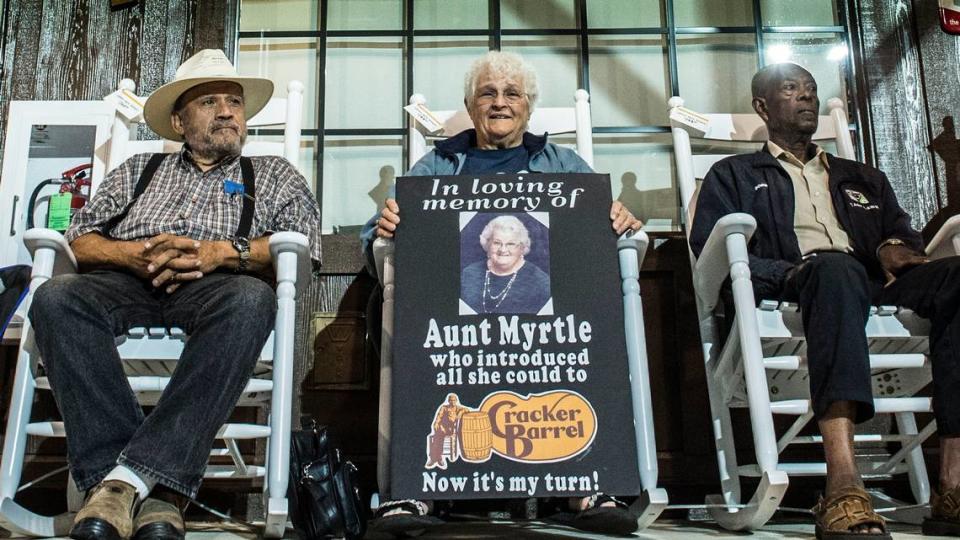 Rosalie Vierra of Sacramento center holds a sign with a picture of her aunt Myrtle, who introduced her to Cracker Barrel, during the 2018 grand opening of the restaurant in Arden Arcade. Vierra said she cut her vacation in Yellowstone National Park short to be at the opening.