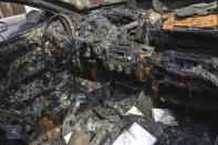 This photo issued by Armenian Foreign Ministry shows a car destroyed by shelling in Stepanakert, the self-proclaimed Republic of Nagorno-Karabakh, Azerbaijan, Tuesday, Sept. 29, 2020. Armenian and Azerbaijani forces accused each other of attacks on their territory Tuesday, as fighting over the separatist region of Nagorno-Karabakh continued for a third straight day following the reigniting of a decades-old conflict. (Armenian Foreign Ministry via AP)