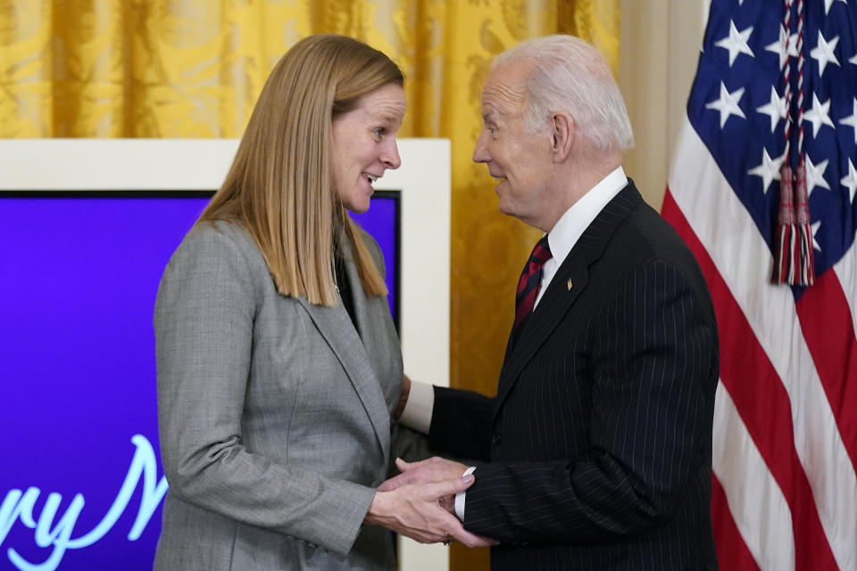 President Joe Biden speaks with Cindy Parlow Cone during an event to celebrate Equal Pay Day and Women's History Month in the East Room of the White House on March 15, 2022. (AP Photo/Patrick Semansky, File)