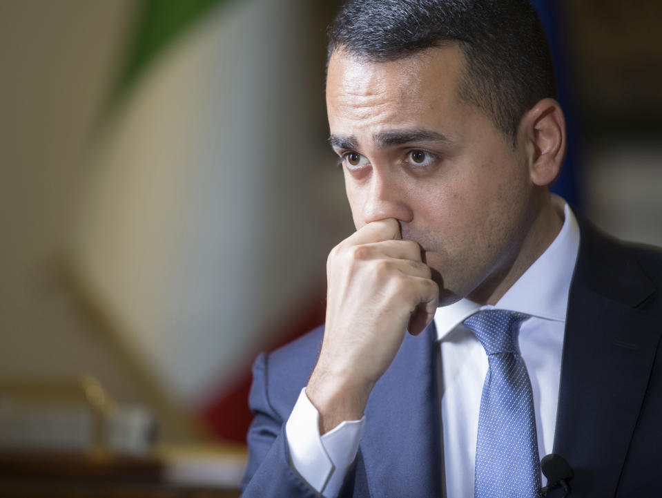 Italian Foreign Minister Luigi Di Maio listens to questions during an interview with The Associated Press in his studio in Rome, Tuesday, Feb. 4, 2019. Di Maio says there is no risk his country will leave the European Union but is calling for reforms to give more weight to European lawmakers since they are directly elected by citizens. (AP Photo/Domenico Stinellis)