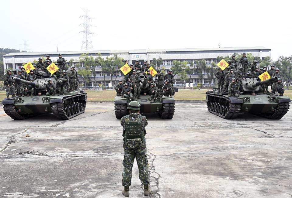 Taiwan army soldiers pose for photos on U.S.-made M60-A3 tanks after a live-fire exercise in Taichung, central Taiwan, Jan. 17, 2019. / Credit: Getty