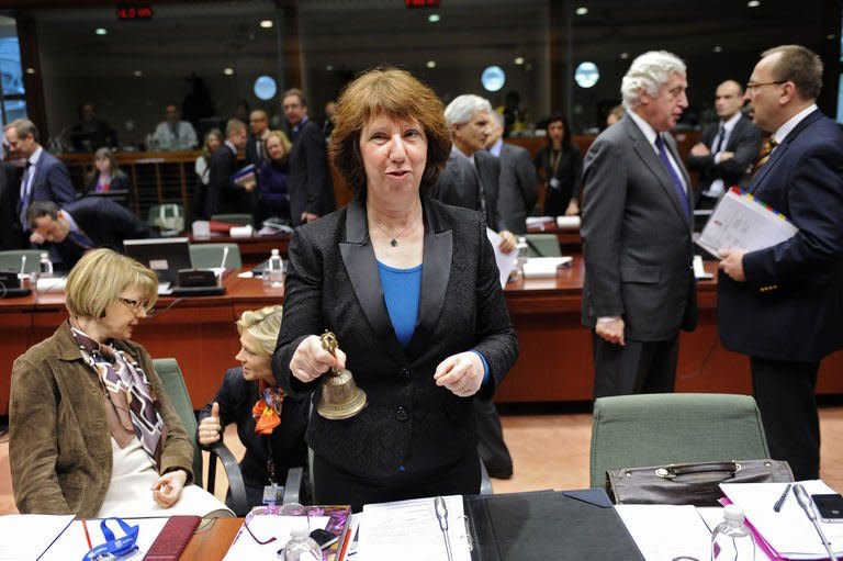 High Representative of the European Union for Foreign Affairs and Security Policy Catherine Ashton rings the bell before a Foreign Affairs Council at the EU Headquarters in Brussels on February 18, 2013