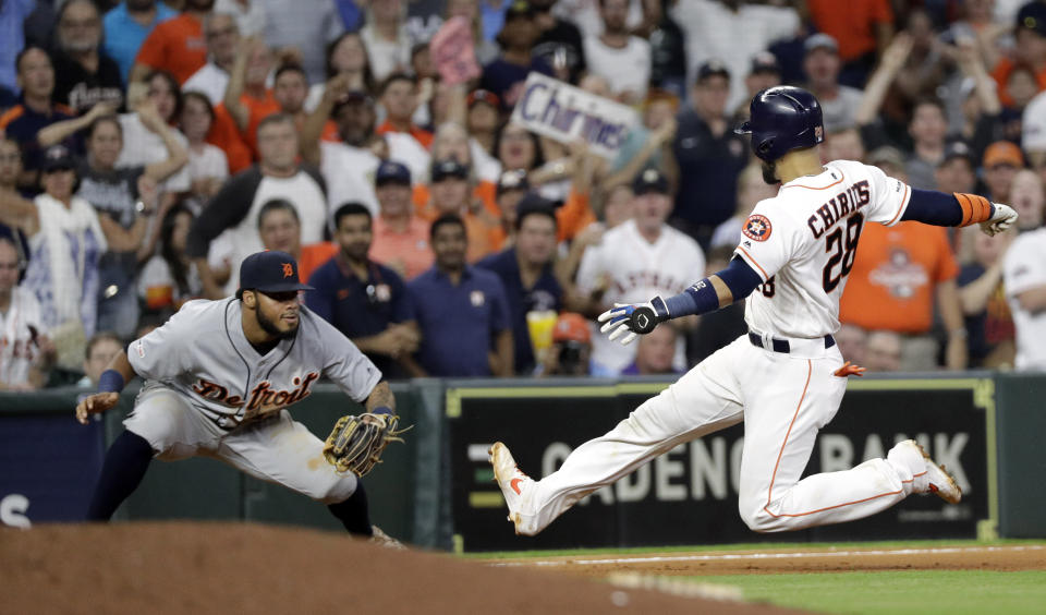 Houston Astros' Robinson Chirinos (28) is tagged out by Detroit Tigers third baseman Dawel Lugo while trying to stretch a double into a triple during the ninth inning of a baseball game Wednesday, Aug. 21, 2019, in Houston. The Tigers won 2-1. (AP Photo/David J. Phillip)