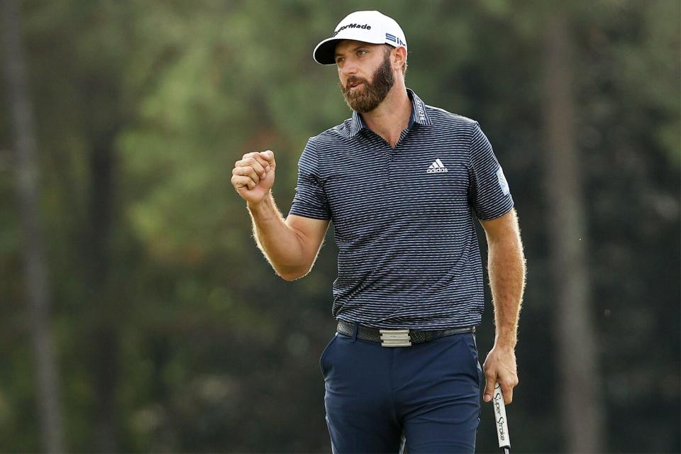 Dustin Johnson of the USA celebrates his victory on the 18th green during the Masters at Augusta National Golf Club on November 15, 2020 in Augusta, Georgia.