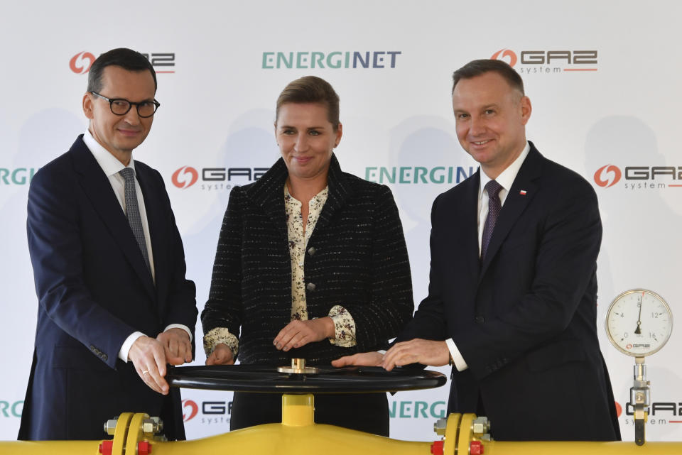 Polish Prime Minister Mateusz Morawiecki, left, Prime Minister of Denmark Mette Frederiksen, center, and President of Poland Andrzej Duda, right, take part in an opening ceremony of the Baltic Pipe in Budno, Poland, Tuesday, Sept. 27, 2022. The event marks the end of the process of the Baltic Pipe construction, a key route to carry gas from Norway through Denmark to Poland and neighboring countries. (AP Photo)