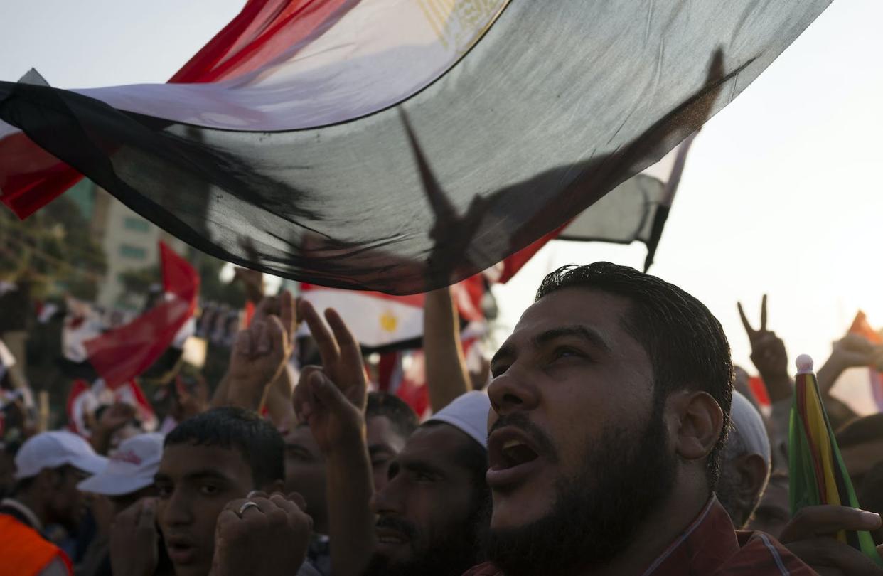 Members of the Muslim Brotherhood protest at a rally in 2013. <a href="https://www.gettyimages.com/detail/news-photo/members-of-the-muslim-brotherhood-and-supporters-of-ousted-news-photo/173509620?phrase=Muslim%20Brotherhood%20flag%20Egypt&adppopup=true" rel="nofollow noopener" target="_blank" data-ylk="slk:Carsten Koall/Getty Images;elm:context_link;itc:0;sec:content-canvas" class="link ">Carsten Koall/Getty Images</a>