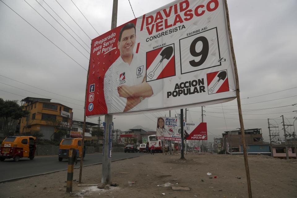 Billboards featuring candidates for Congress stand in the Villa Maria del Triunfo shantytown of Lima, Peru, Thursday, Jan. 23, 2020. A new legislative body will be elected on Jan. 26, replacing the congress that was dissolved by President Martin Vizcarra. (AP Photo/Martin Mejia)