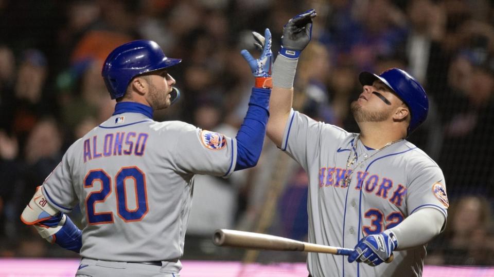 New York Mets first baseman Pete Alonso (20) celebrates with designated hitter Daniel Vogelbach (32) after hitting a two-run home run against the San Francisco Giants.