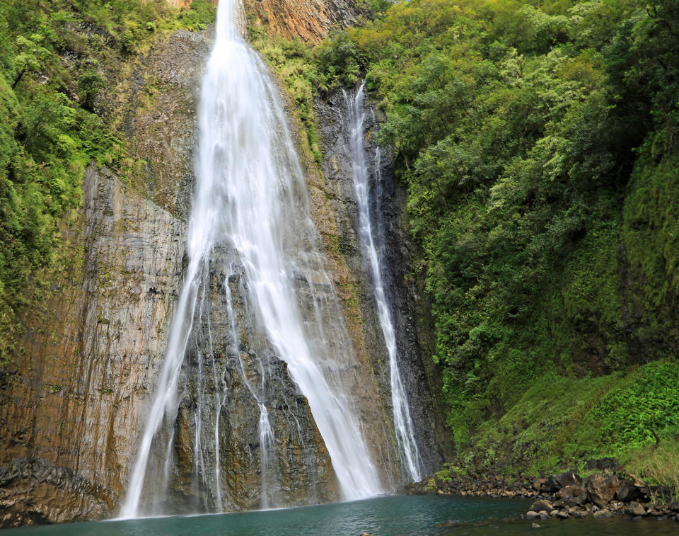 <p>Manawaiopuna Falls on Kauai Island, Hawaii. You may recognize it as the waterfall in the 1993 film “Jurassic Park.” (Photo: iStockphoto/Getty Images) </p>