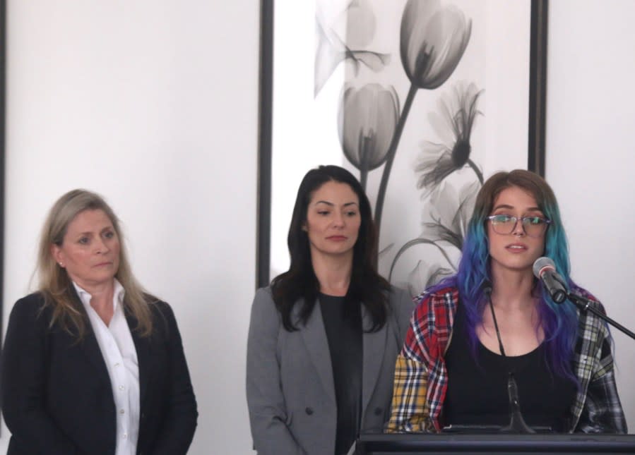 <strong><em>Alleged Sean Williams sexual assault victim Anya speaks during the news conference as attorneys Heather Moore Collins, left, and Elizabeth Kramer look on. (Photo: WJHL)</em></strong>