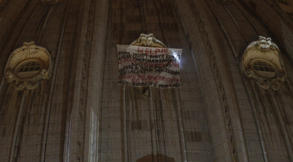 A banner hangs from a window of St. Peter's dome at the Vatican, Tuesday, Oct. 2, 2012. (AP Photo/Alessandra Tarantino)