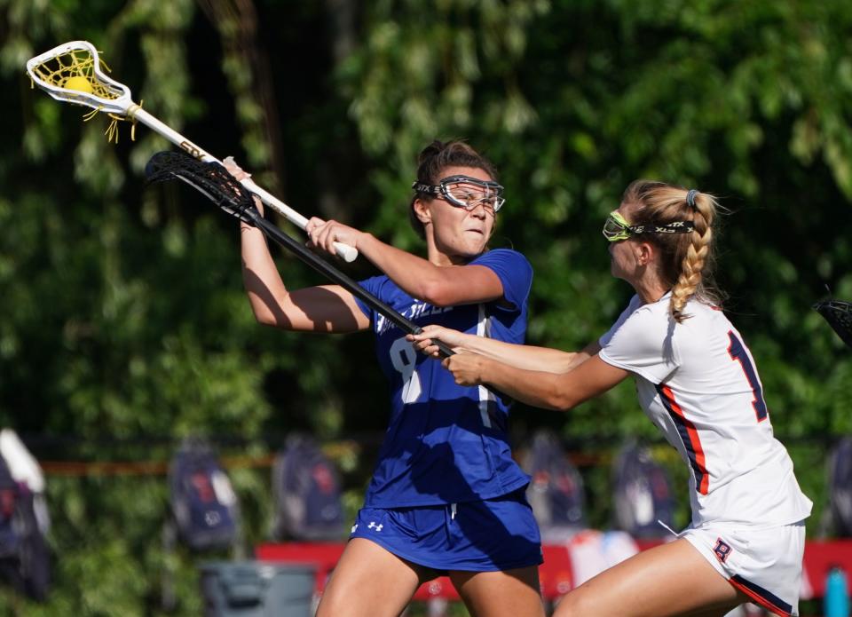 Bronxville's Anna Becker (8) works against Briarcliff's Nico Vargish (11) in the Class D girls lacrosse game at Nyack High School in Nyack on Thursday, May 25, 2023.