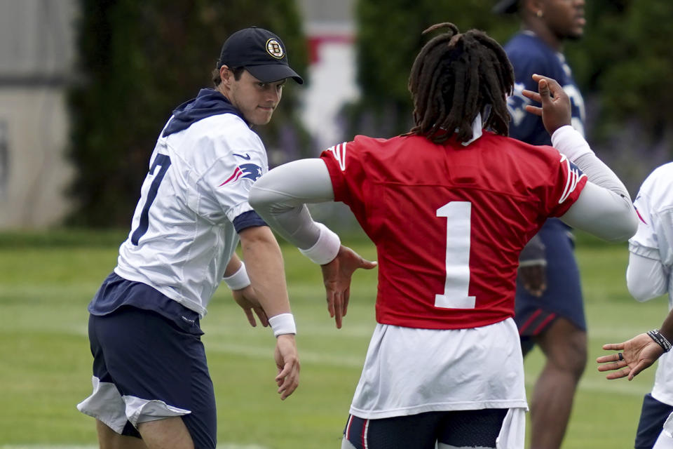 New England Patriots punter Jake Bailey and quarterback Cam Newton swing their arms during NFL football practice in Foxborough, Mass., Friday, June 4, 2021. (AP Photo/Mary Schwalm)