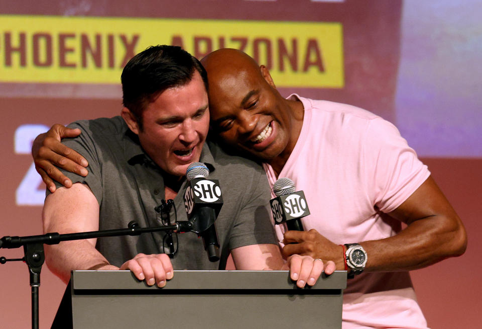 HOLLYWOOD, CALIFORNIA – SEPTEMBER 12: Chael Sonnen receives a hug from Anderson Silva during a Jake Paul v Anderson Silva press conference at NeueHouse Hollywood on September 12, 2022 in Hollywood, California.  (Photo by Harry How/Getty Images)