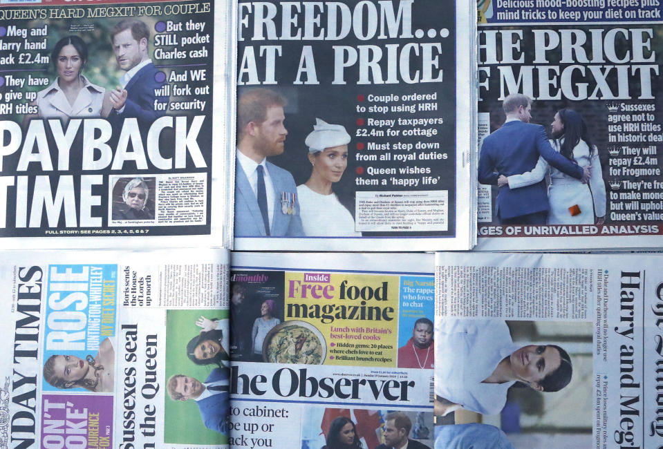 The front pages of London's Sunday newspapers are displayed in London, Sunday, Jan. 19, 2020. The papers fronted the news that Buckingham Palace says Prince Harry and his wife, Meghan, will no longer use the titles "royal highness" or receive public funds for their work under a deal that allows them to step aside as senior royals. (AP Photo/Frank Augstein)