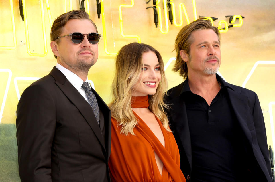 Margot Robbie joins her co-stars Leonardo di Caprio and Brad Pitt on the red carpet [Photo via PA]