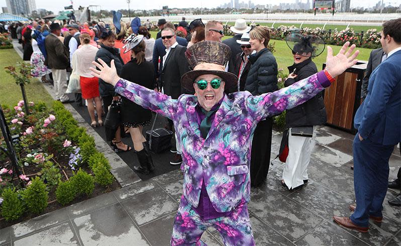 <p>Pictured: Punters brave wild weather as Melbourne Cup festivities get underway</p>