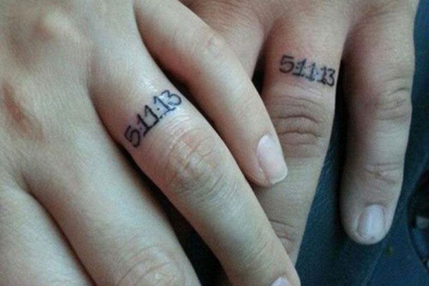 Forget wedding rings, this couple only need their wedding date!